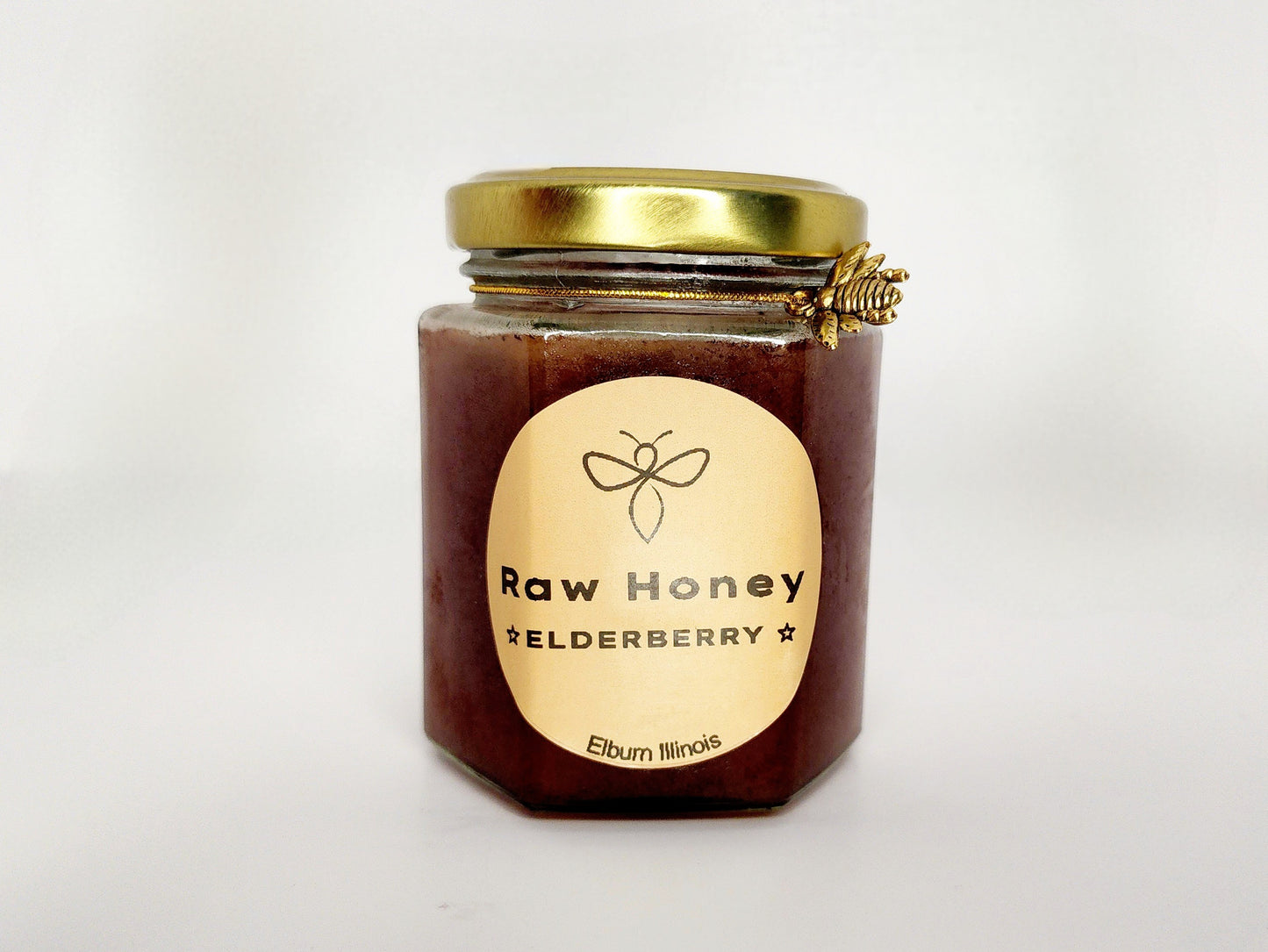 A 10 oz jar of Wildflower Raw Organic Honey