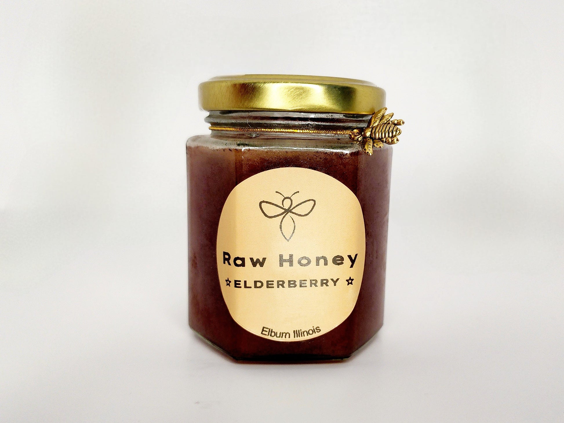 A 10 oz jar of Wildflower Raw Organic Honey