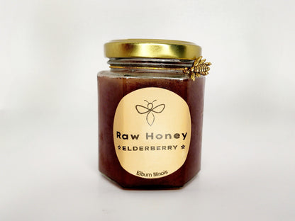 A 10 oz jar of Wildflower Raw Organic Honey